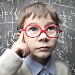 boy with glasses in deep thought